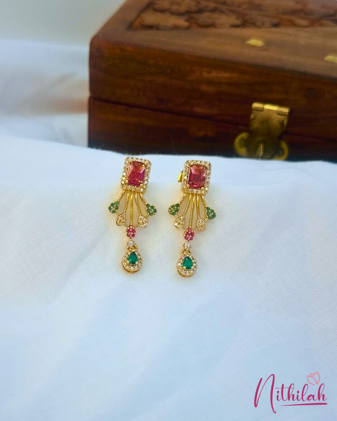 Gold earrings with pink and green gemstones