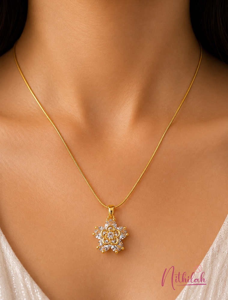 Woman wearing an anti-tarnish gold crystal floral pendant necklace featuring sparkling marquise-cut crystals.