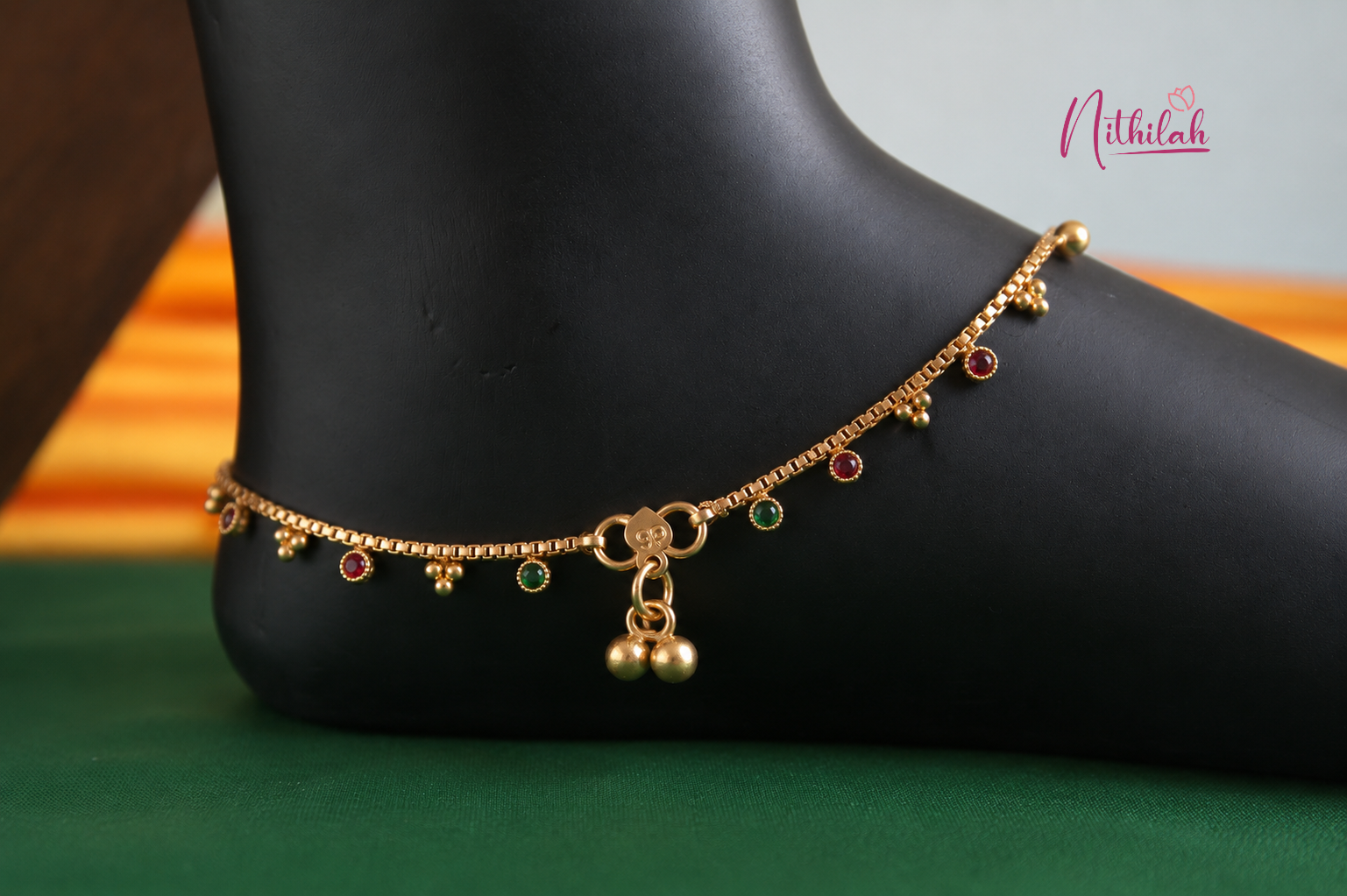 Antique Gold Finish Red and Green Stone Chain Anklet with traditional ghungroo charms for women, perfect for daily wear and festive occasions.