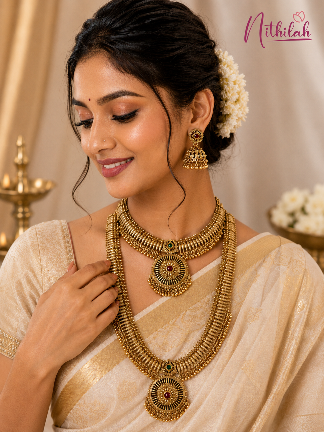 Indian model wearing Antique Gold Finish Traditional Short & Long Necklace Set with matching Jhumka Earrings, perfect for bridal wear, festive occasions and silk sarees.