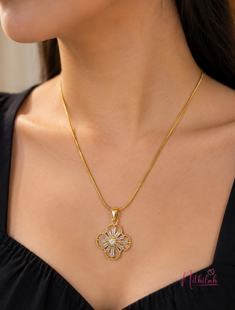Woman wearing a gold floral crystal pendant necklace with sparkling stones for everyday elegance.