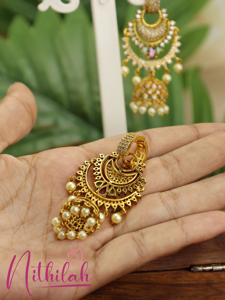 Back view of a gold-plated American Diamond Chandbali jhumka earring with intricate detailing and pearl drops.