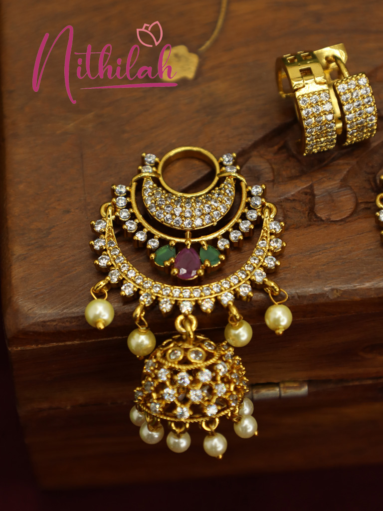 Single gold-plated AD Chandbali jhumka earring with a pink centre stone, green accents, and cream pearl drops.
