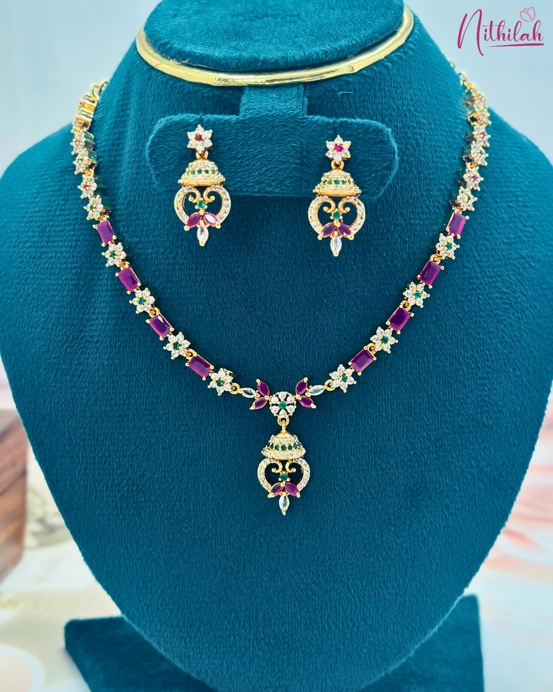 Elegant Ruby Pink CZ Gold Finish Necklace Set styled on mannequin - bridal jewellery
