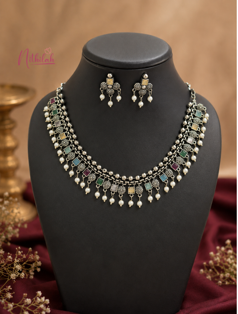 Oxidised silver multicolour stone necklace set with pearl drops displayed on a premium jewellery bust.